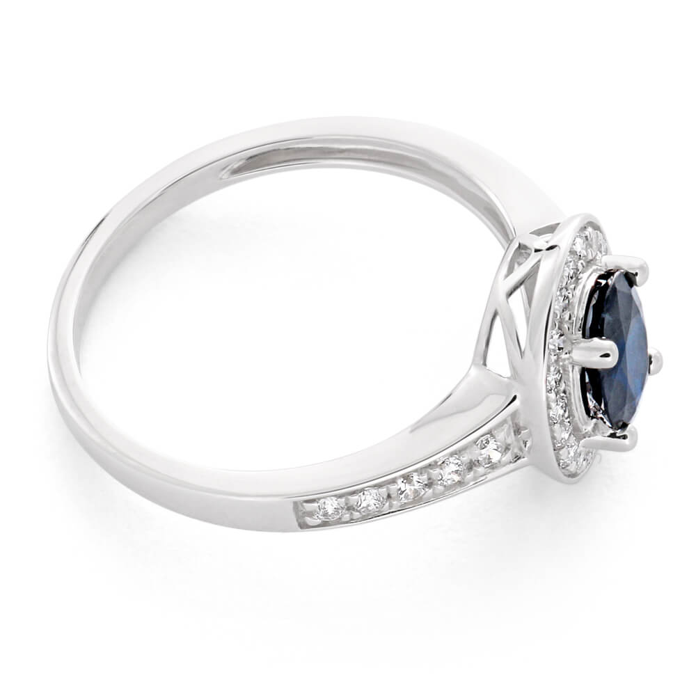 Stunning 9 Carat White Gold Engagement Ring Featuring a 1.05 Carat Natural Deep Blue Sapphire of 7x5mm and 0.26 Carat Diamonds