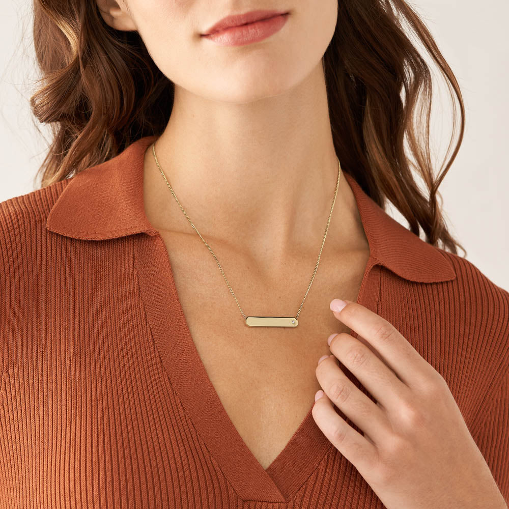 Fossil Stylish Yellow Gold Coated Stainless Steel Drew Identification Pendant along with a Chain