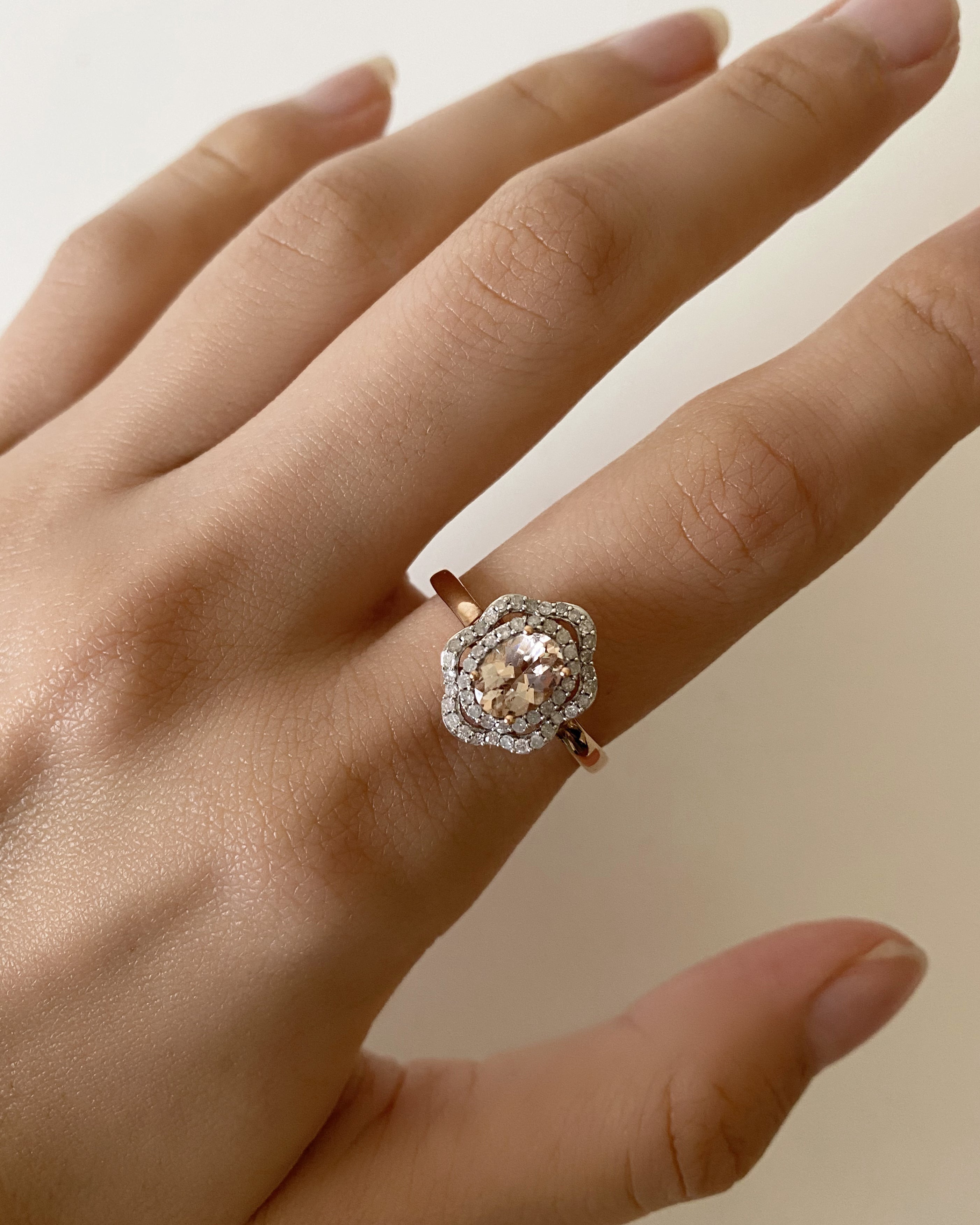 Exquisite 9ct Rose Gold Floral Halo Engagement Ring Featuring 7x5mm 0.65 Carats Morganite and 0.25 Carats Diamonds