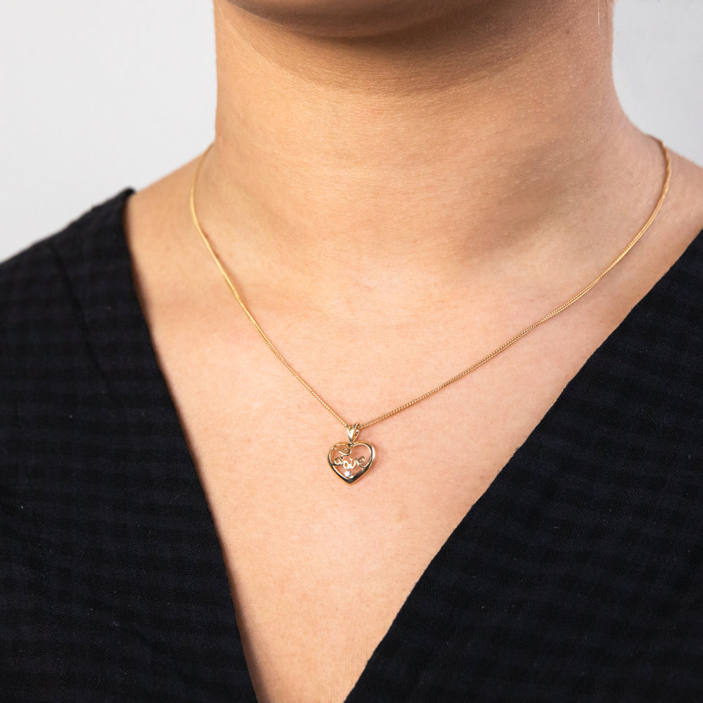 Stunning 9ct Yellow Gold Zirconia-Embedded 'Love' Heart-Shaped Pendant for Jewelry Lovers