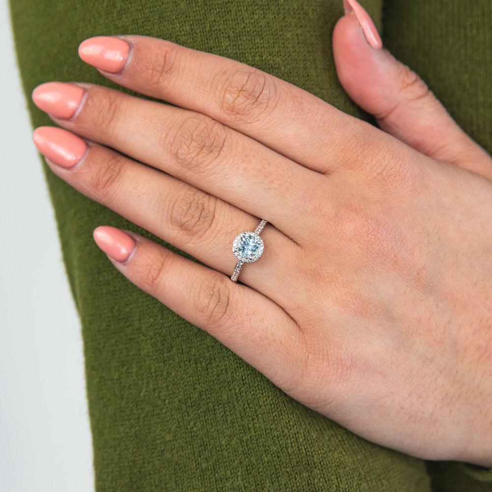 Stunning 9ct White Gold Ring with 0.75ct Aquamarine and 1/10 Carat Diamond Halo