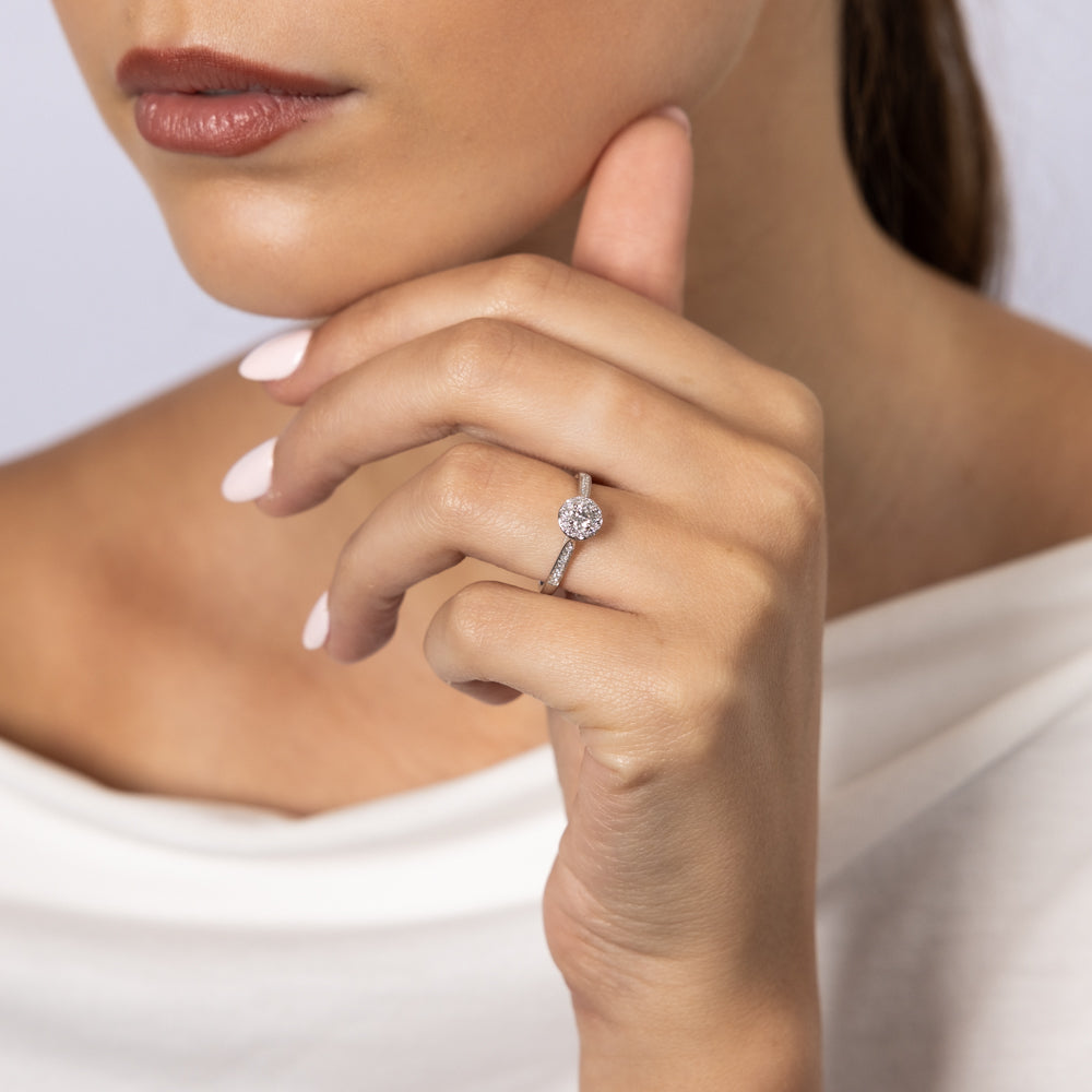 Exquisite 9 Carat White Gold Solitaire Ring with a 0.30 Carat Diamond Halo