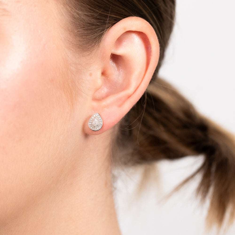 A Pair of 1/4 Carat Pear - Shaped Diamond Stud Earrings Crafted in 9 - carat Yellow Gold