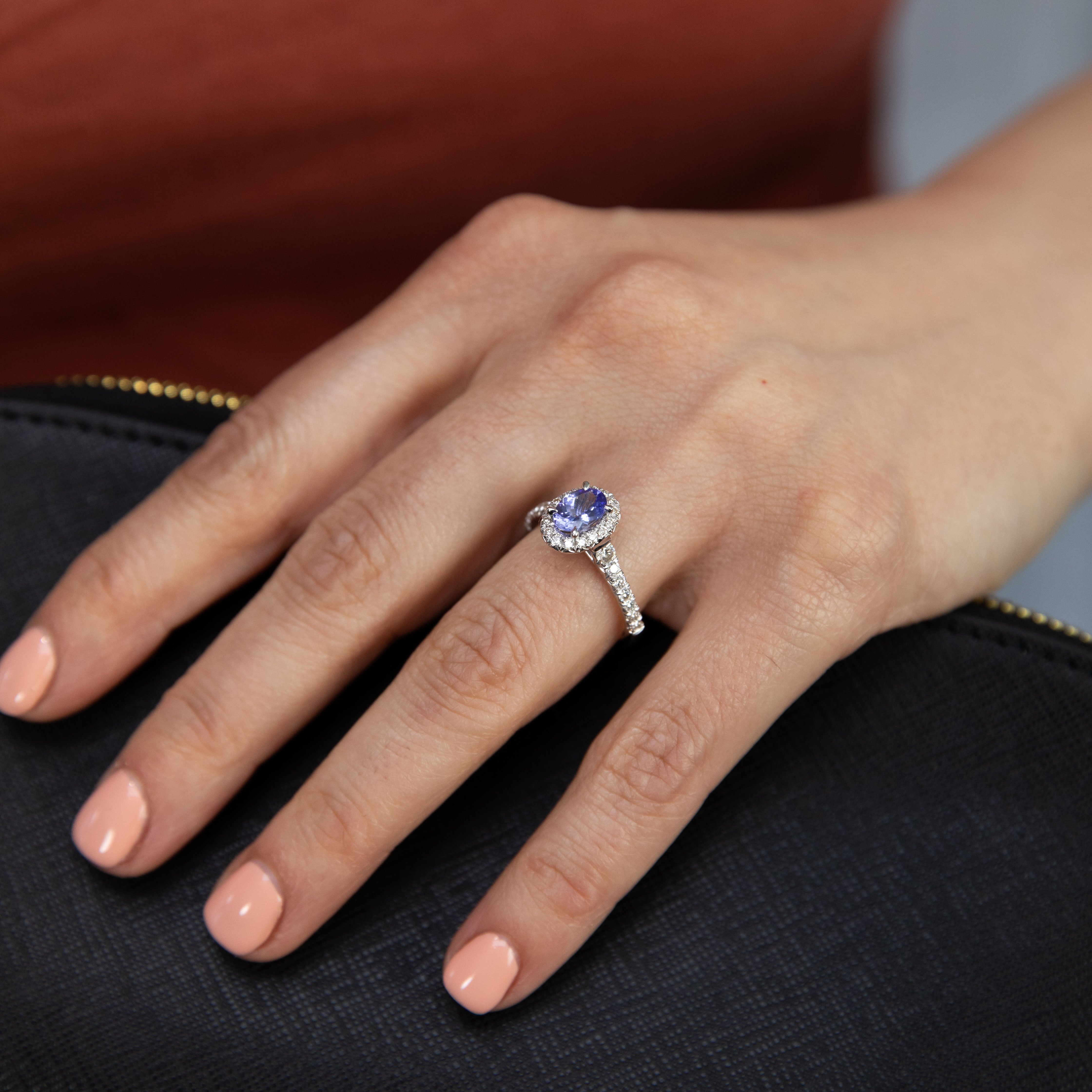 Exquisite 9 Carat White Gold Oval Halo Ring with Tanzanite and Diamonds
