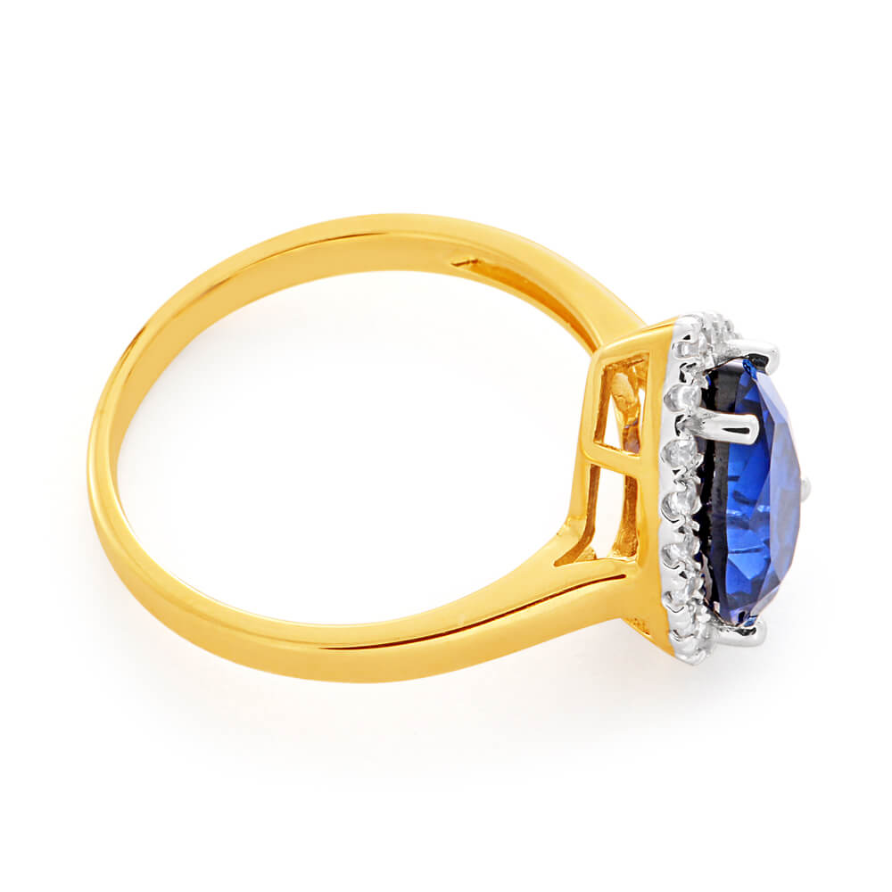 9ct Yellow Gold Ring with Pear - shaped Created Sapphire and Cubic Zirconia Halo