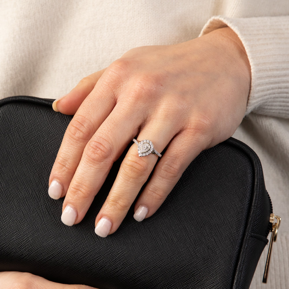 Exquisite 9 Carat Yellow Gold Pear - Shaped Diamond Ring with 1/6 Carat Diamonds for Fine Jewelry Lovers