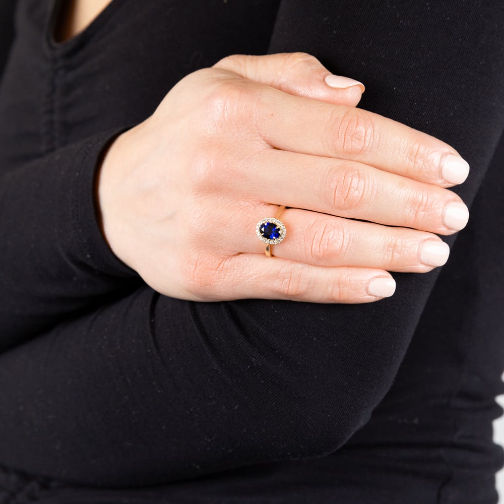 Exquisite 9ct Yellow Gold Oval Created Sapphire with Diamond Halo Ring