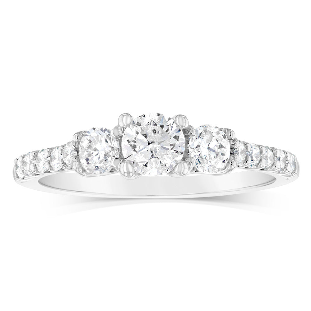Exquisite 14 Carat White Gold Diamond Trilogy Ring with 1 Carat Brilliant Cut Diamonds and Additional Diamonds on the Shank, A Timeless Jewelry Piece