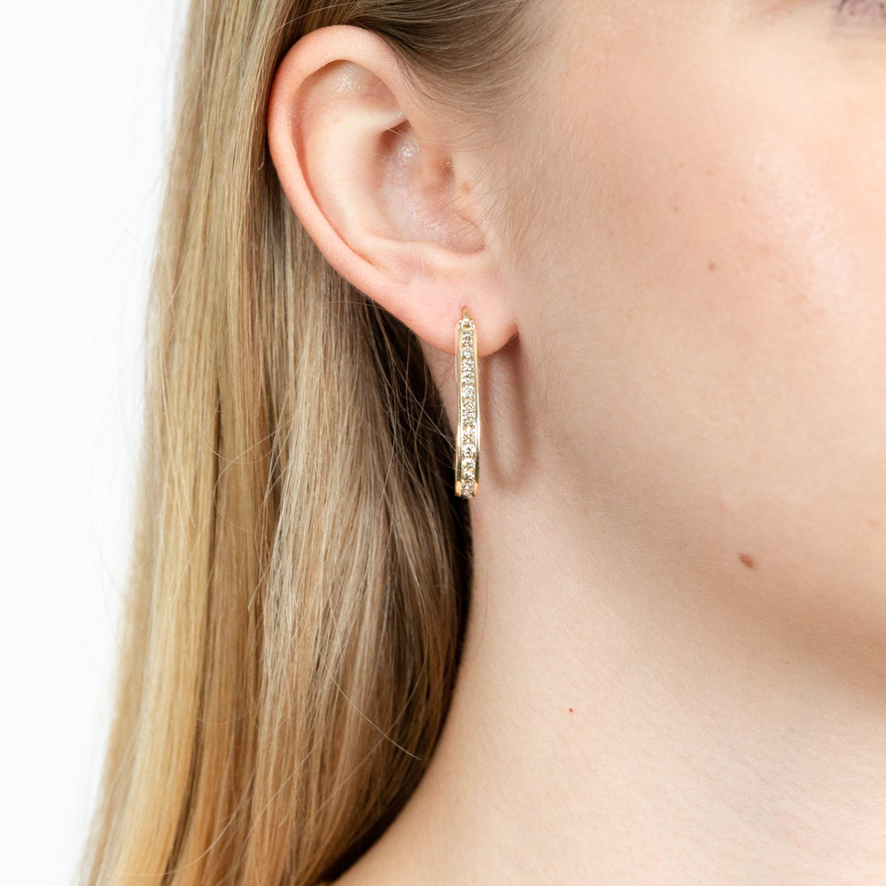 Gorgeous 9 Carat Yellow Gold Hoop Earrings with a 1 - Carat Channel Set of 28 Brilliant - Cut Diamonds
