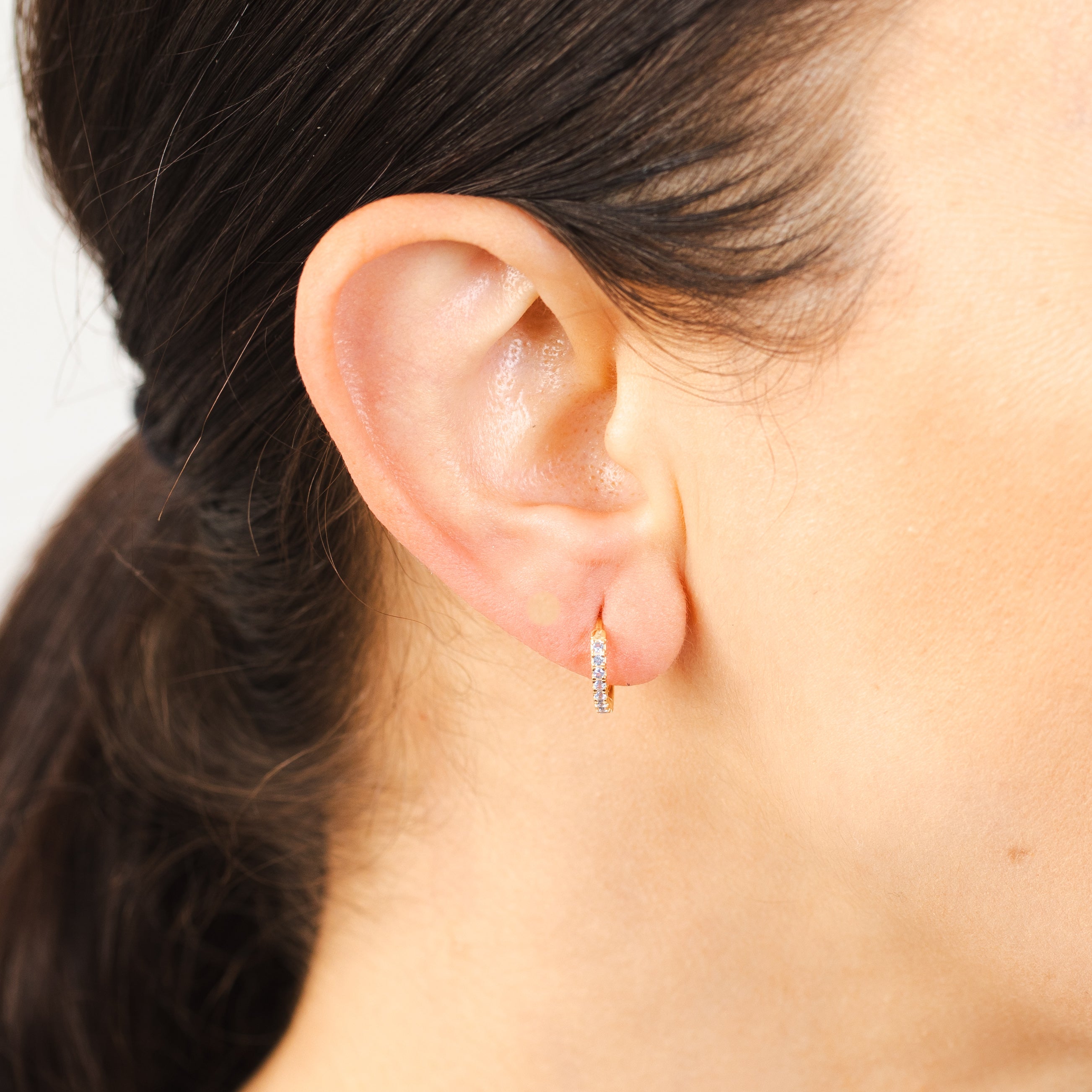 Stunning 9 Carat Yellow Gold Hoop Earrings with Hypnotic Light Blue Zirconia Gemstones
