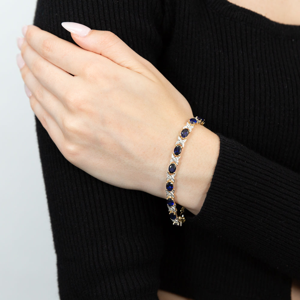 19cm 9ct Yellow Gold Crossover Bracelet with 7x5mm Oval Cut Lab-Created Sapphires and Diamonds