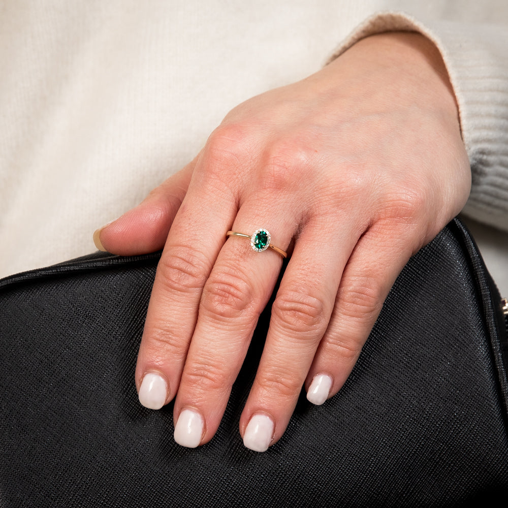 Exquisite 9ct Yellow Gold Ring with a Halo of Diamonds and a Created Oval Emerald