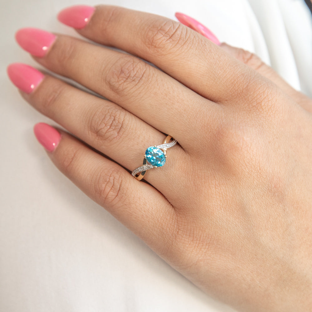 9ct Yellow Gold Ring with Cross-Over Design, Blue Topaz and Diamonds