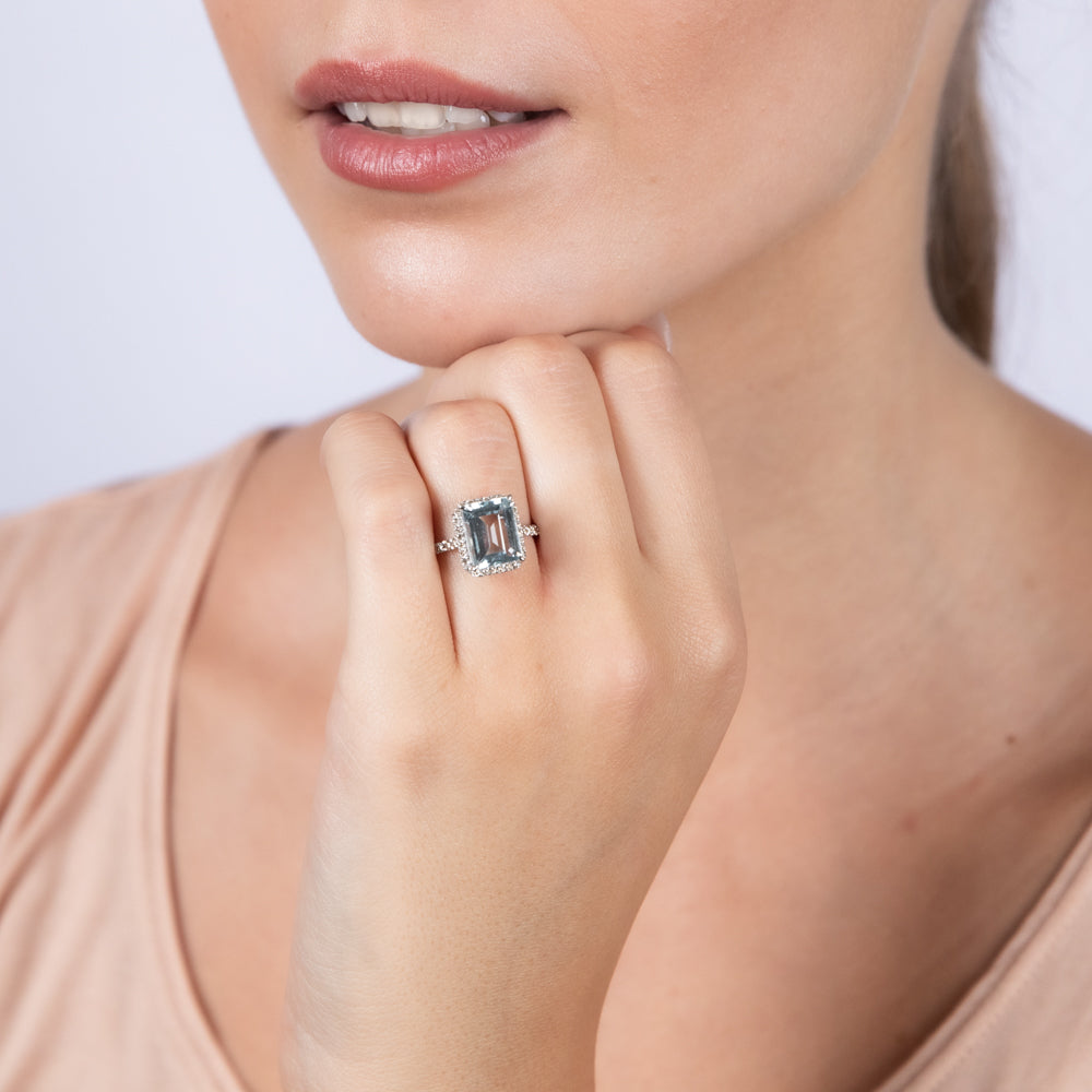 Stunning 9 Carat White Gold Ring Featuring 2.4 Carat Aquamarine and One - Third Carat Diamond