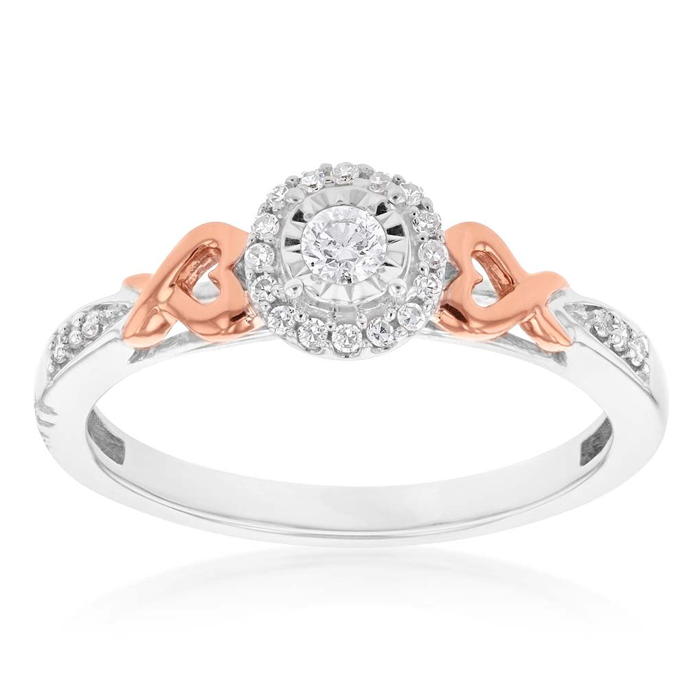 Exquisite 10 Carat White Gold Engagement Ring Adorned with Natural Enhanced Pink Sapphires and Rose Gold Heart Detailing on the Band