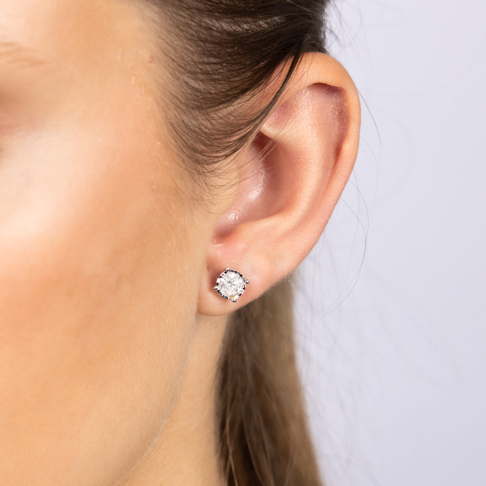 Exquisite 10-Carat White Gold 0.95 Carat Diamond Solitaire Stud Earrings for Elegant Jewelry Lovers