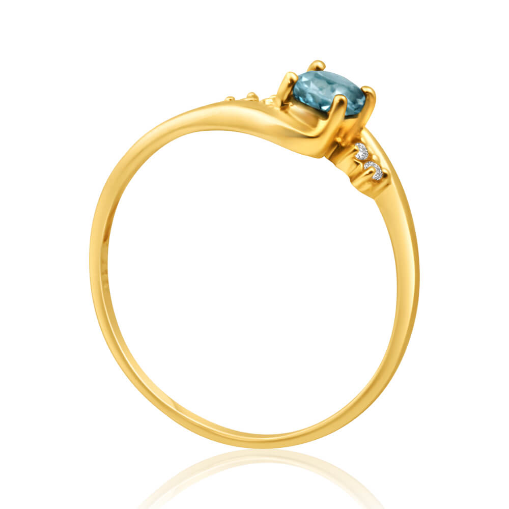 Exquisite 9 Carat Yellow Gold Ring with Blue Topaz and Four Cubic Zirconia Stones
