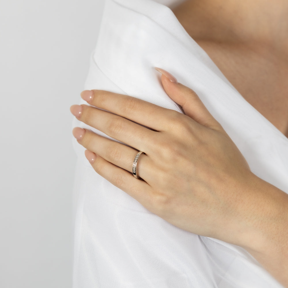 9ct White Gold Classic Eternity Straight Engagement Ring Adorned with 9 Sparkling Brilliant Cut Diamonds