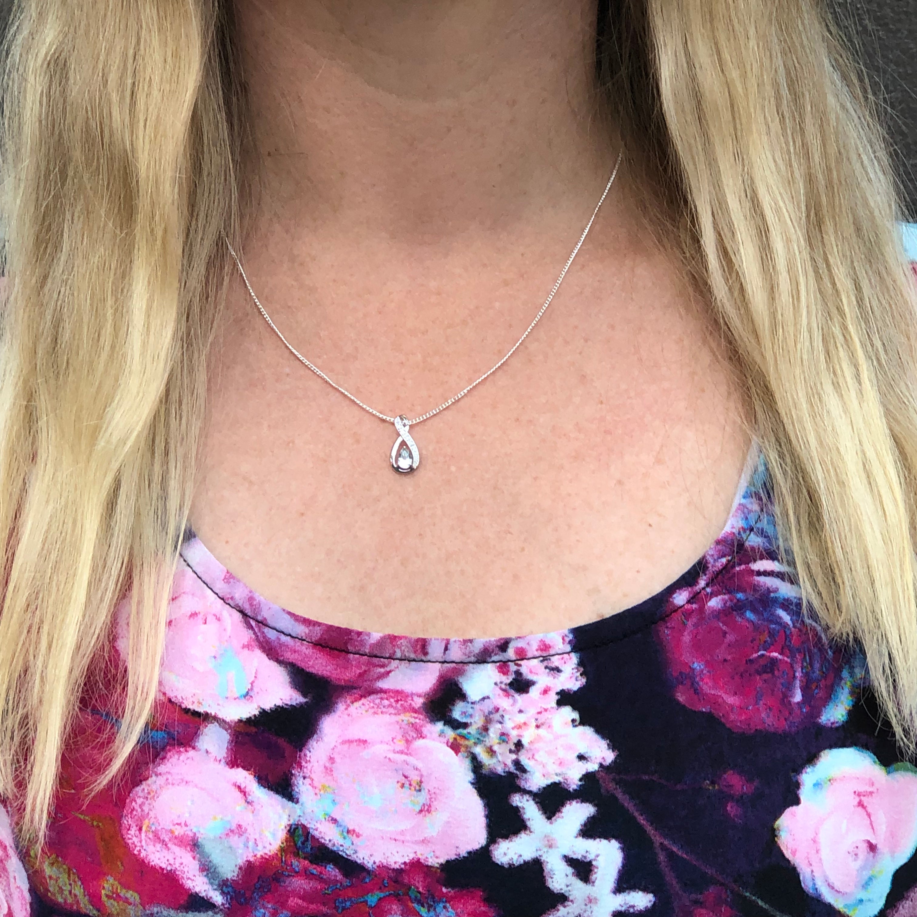 Stylish 9ct White Gold Aquamarine and Diamond Infinity-Shaped Pendant