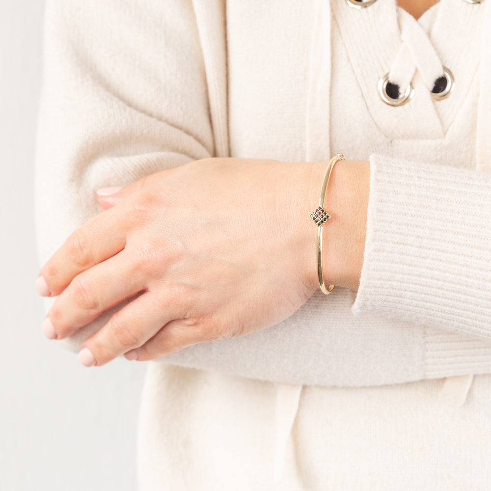 Stylish 9-carat Yellow Gold Bangle Embellished with Black Cubic Zirconias